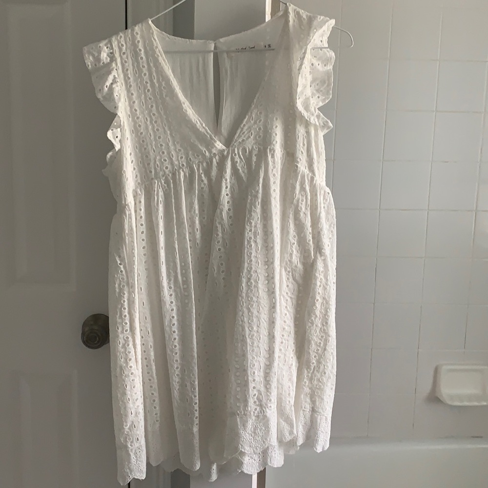 beautiful white romper dress from a local boutique